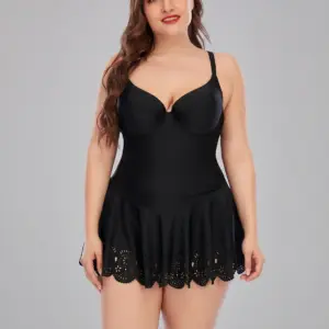 Woman in black lace swimsuit, smiling