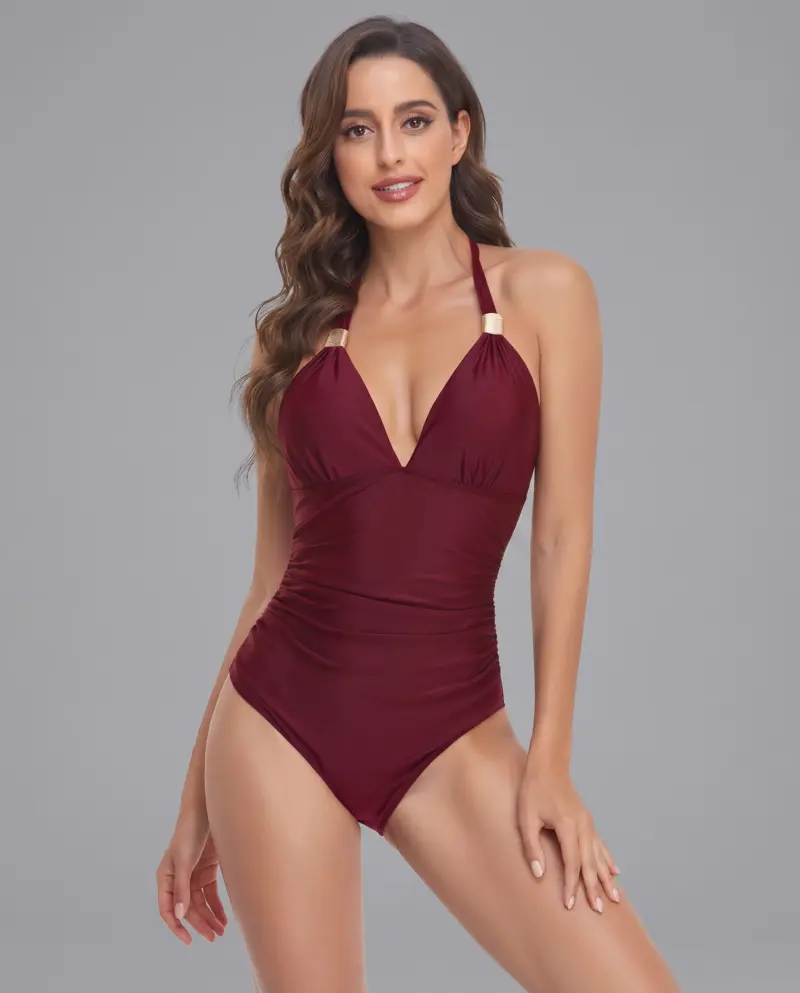 Mature woman in burgundy one-piece swimsuit